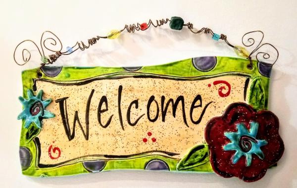 Welcome plaque with flowers picture