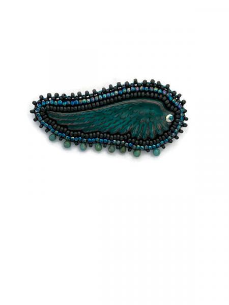 Enameled metal teal wing pin picture