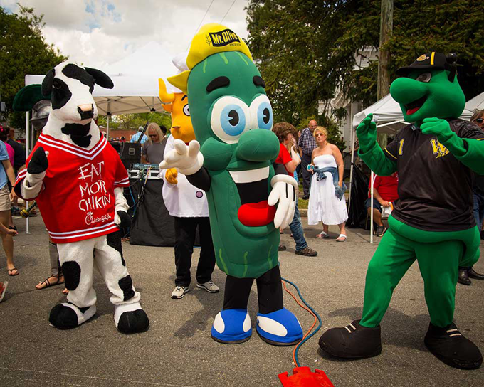 North Carolina Pickle Festival mascot roaming with Chick-fil-A mascot