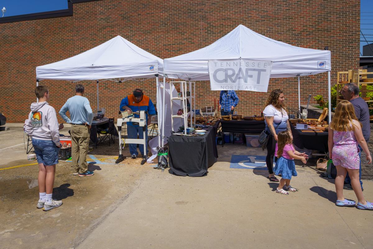 Tennessee Craft booth with a woodturner