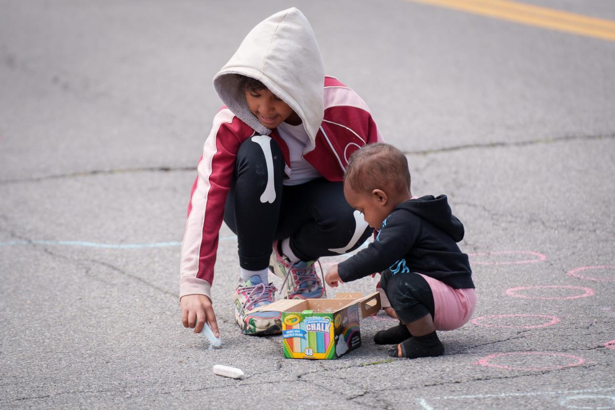 Children drawing with chalk