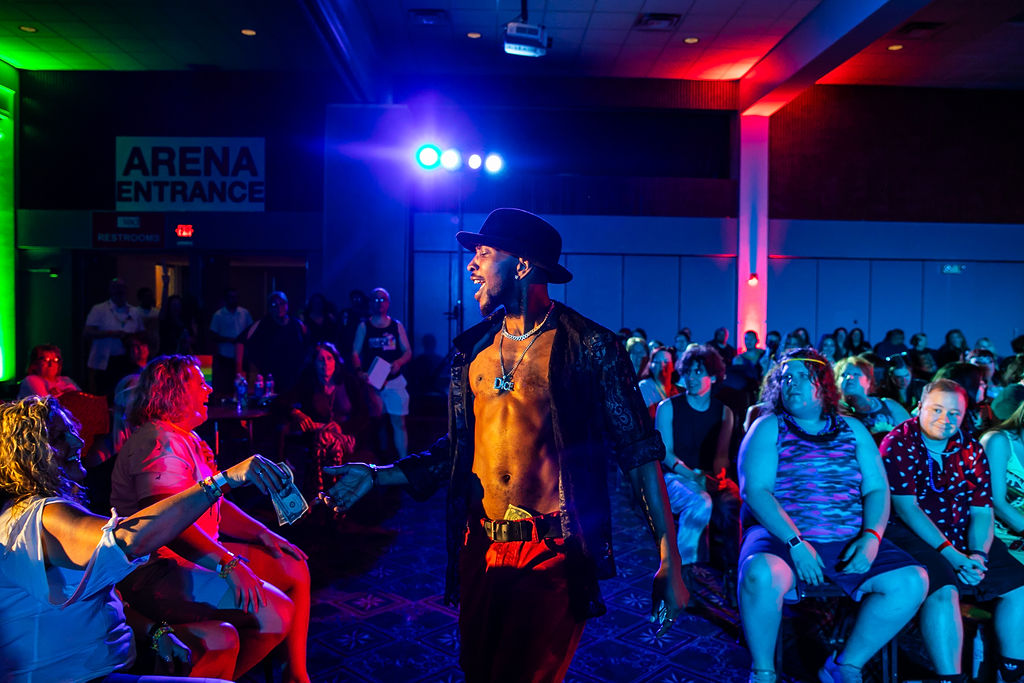 Pride After Party Drag Show performing out among the crowd.