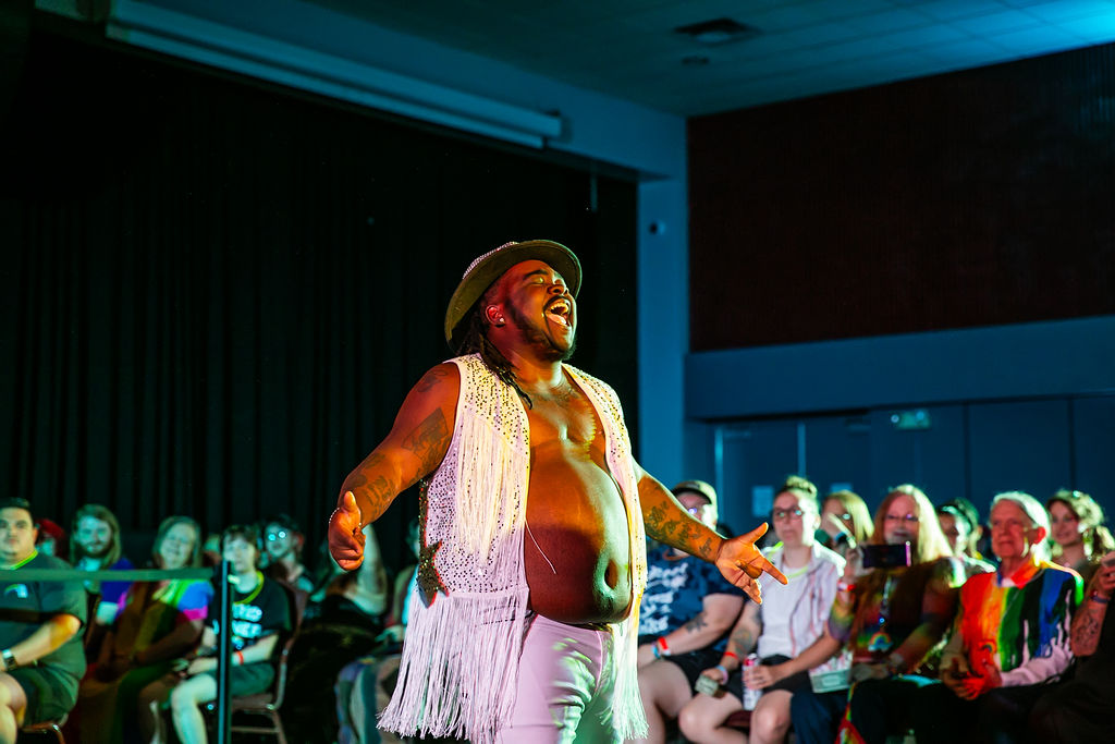 Pride After Party Drag Show drag performer performing among the crowd.
