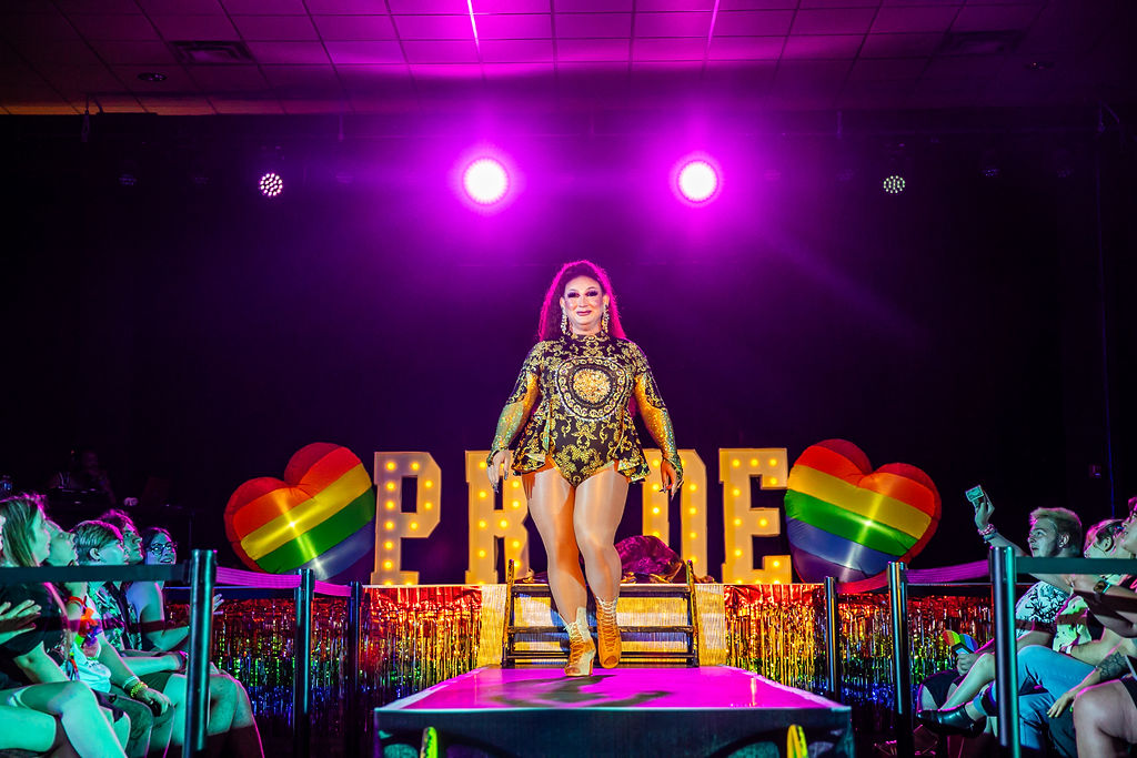 Pride After Party Drag Show drag performing posing at the edge of the stage catwalk.