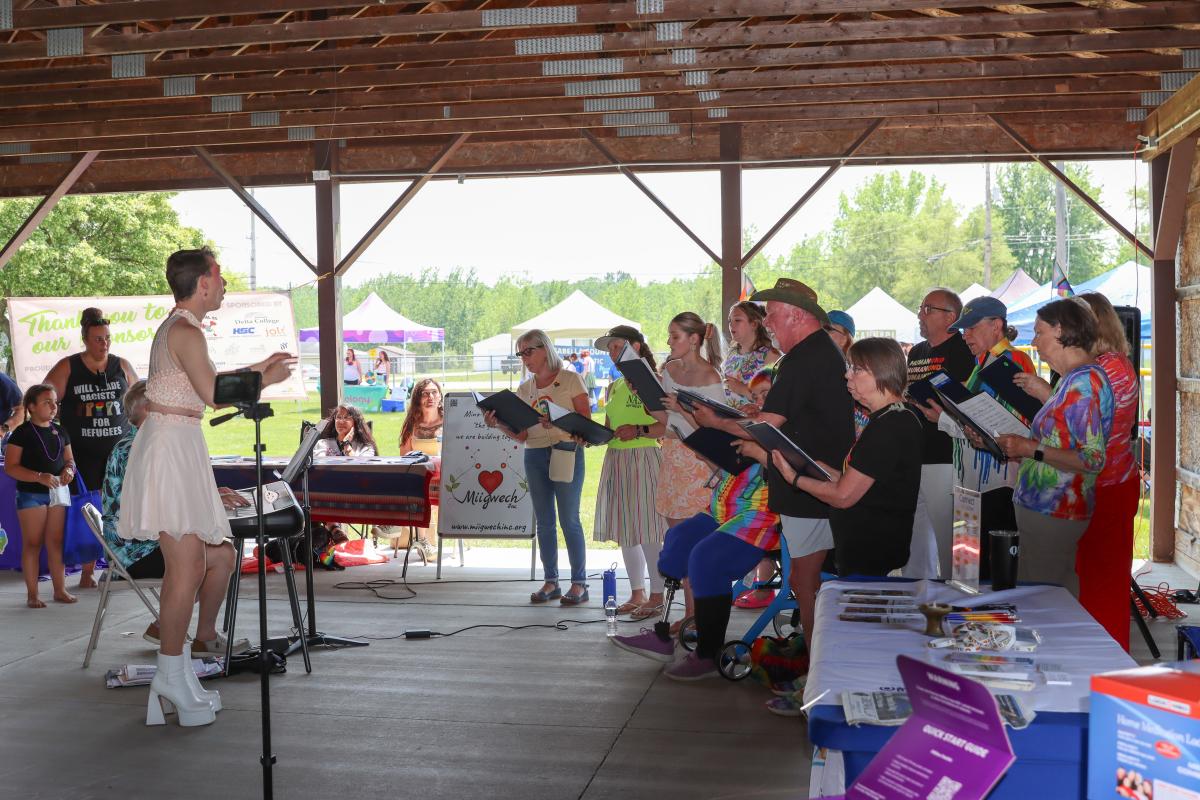 The Harmony Diversity Choir performing under the pavilion.