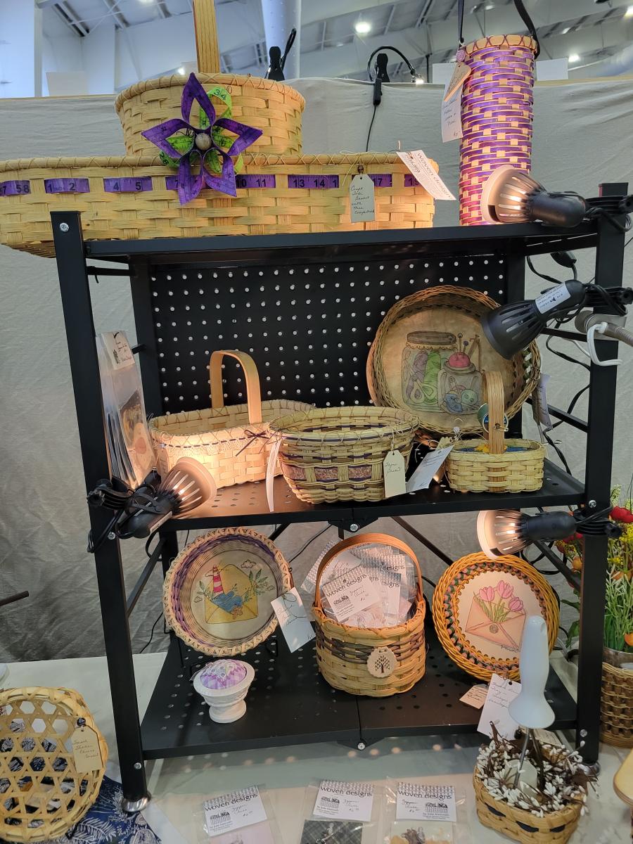 woven reed baskets on display in a booth