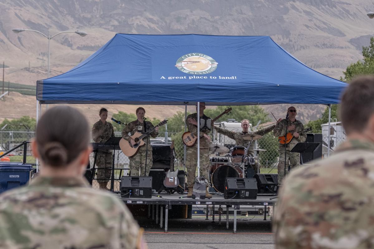 Nebraska National Guard band playing on stage.