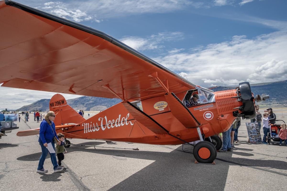 Miss Veedol, redish orange airplane.