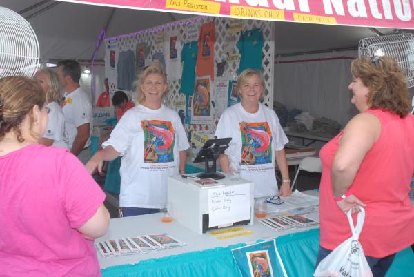 Merchandise Volunteers ready to show you OFFICIAL Shrimp Festival Merchandise. Accept no substitute.