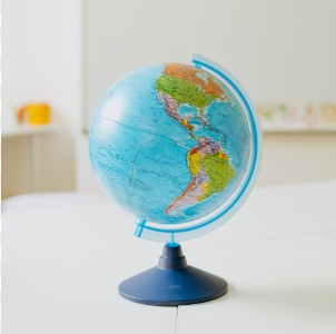 this is a photo of a globe on a desk