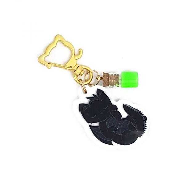 Sleeping Black Dragon Cat with Potion Charm picture