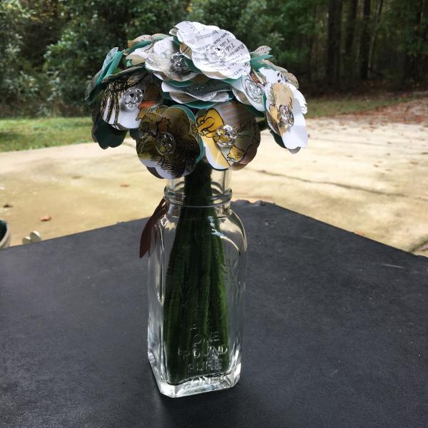 Winnie the pooh meets some bees hand-cut paper flower arrangement in a clear glass honey bottle