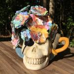 Peter Pan little golden book hand-cut paper flower arrangement in skull mug vase