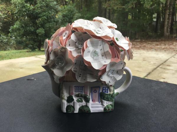 Music Sheet "It's a Small World" hand-cut paper flower arrangement in cottage teapot