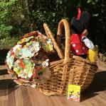 Mickey Mouse's picnic hand-cut paper flower arrangement in picnic basket, with small plush Minnie