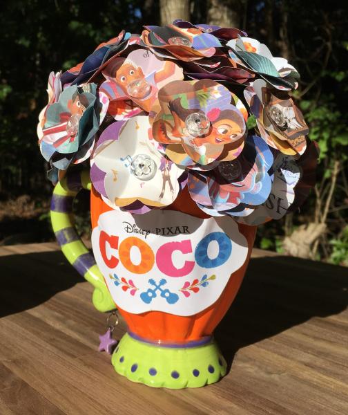 Coco little golden book hand-cut paper flower arrangement in smiling pumpkin mug picture