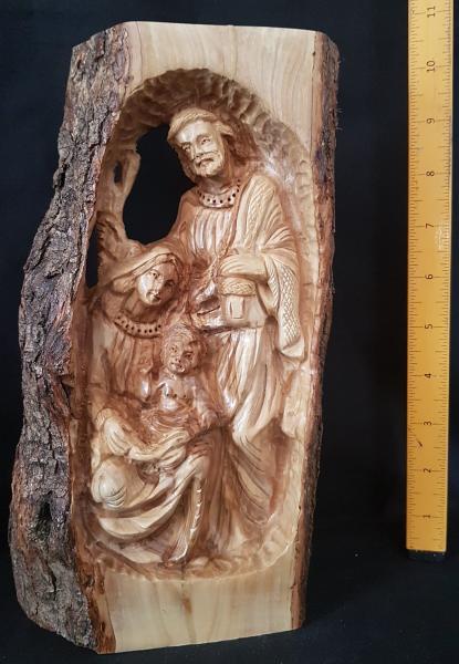 Detailed Hand Carved Holy Family inside Tree Branch picture