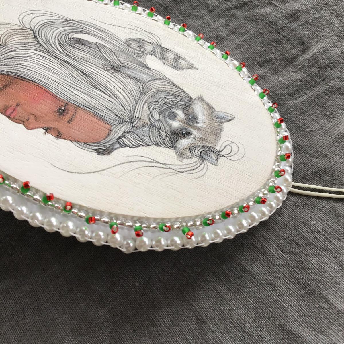 Tangled Hair Oval Raccoon Ornament picture