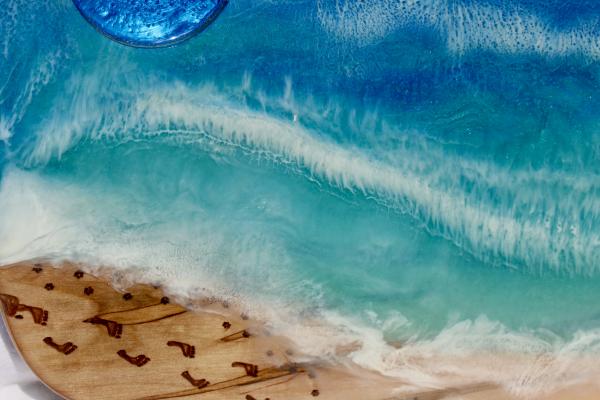 Ocean - footsteps disappearing along the beach picture