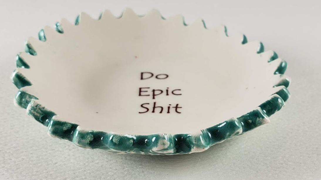 Tiny plate with "Do Epic Shit" picture