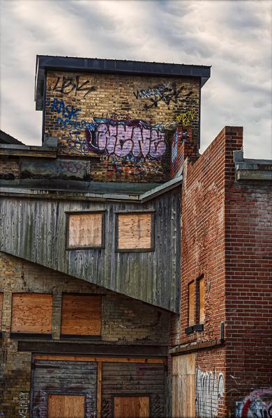 "Brickworks with Plywood and Graffiti"