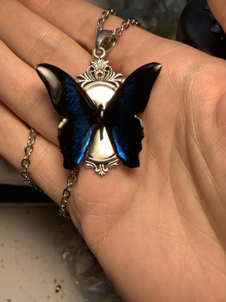 Black and iridescent blue butterfly pendant picture