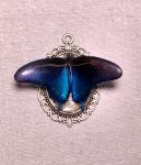 Iridescent blue butterfly pendant