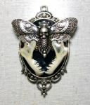Metal deathshead moth and real bat jawbones pendant