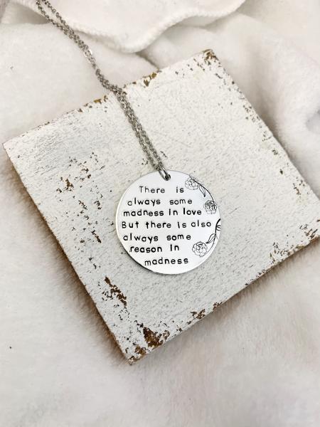 There is always some madness in love necklace picture