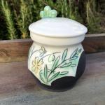 green and yellow herb jar