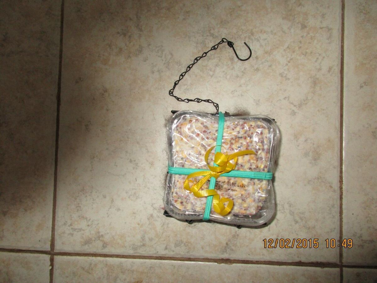 Handcrafted wire suet feeder/nester with suet and Alpaca fiber for nesting picture