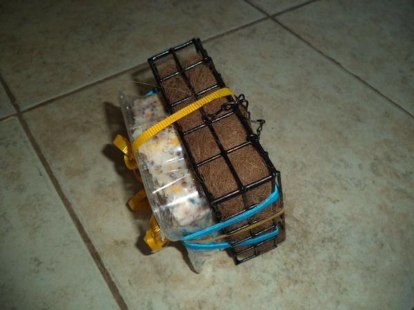 Handcrafted wire suet feeder/nester with suet and Alpaca fiber for nesting