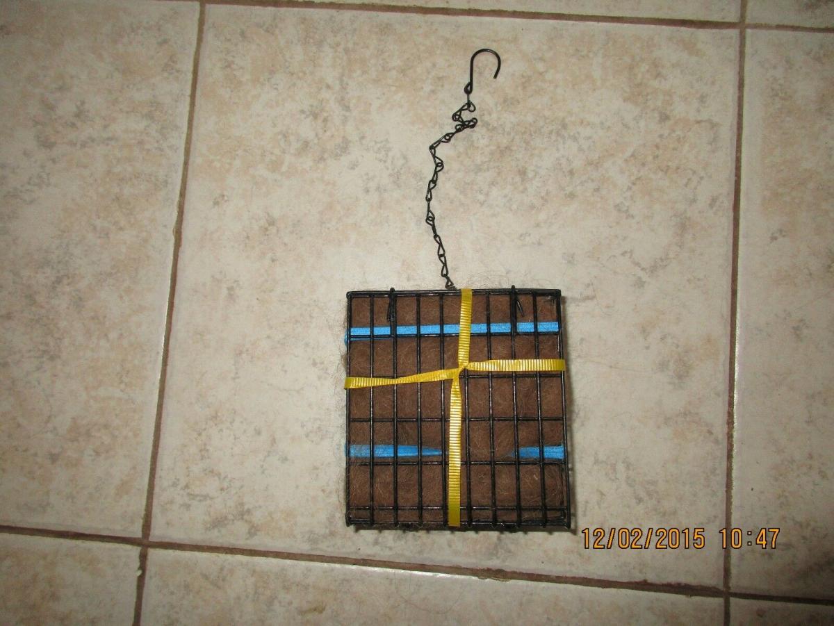 Handcrafted wire suet feeder/nester with suet and Alpaca fiber for nesting picture