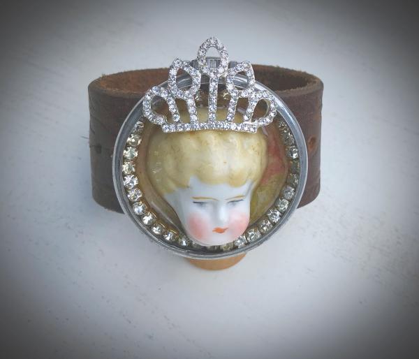 Leather cuff with antique doll picture