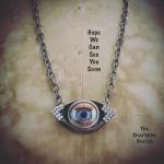 Blinking doll eye necklace