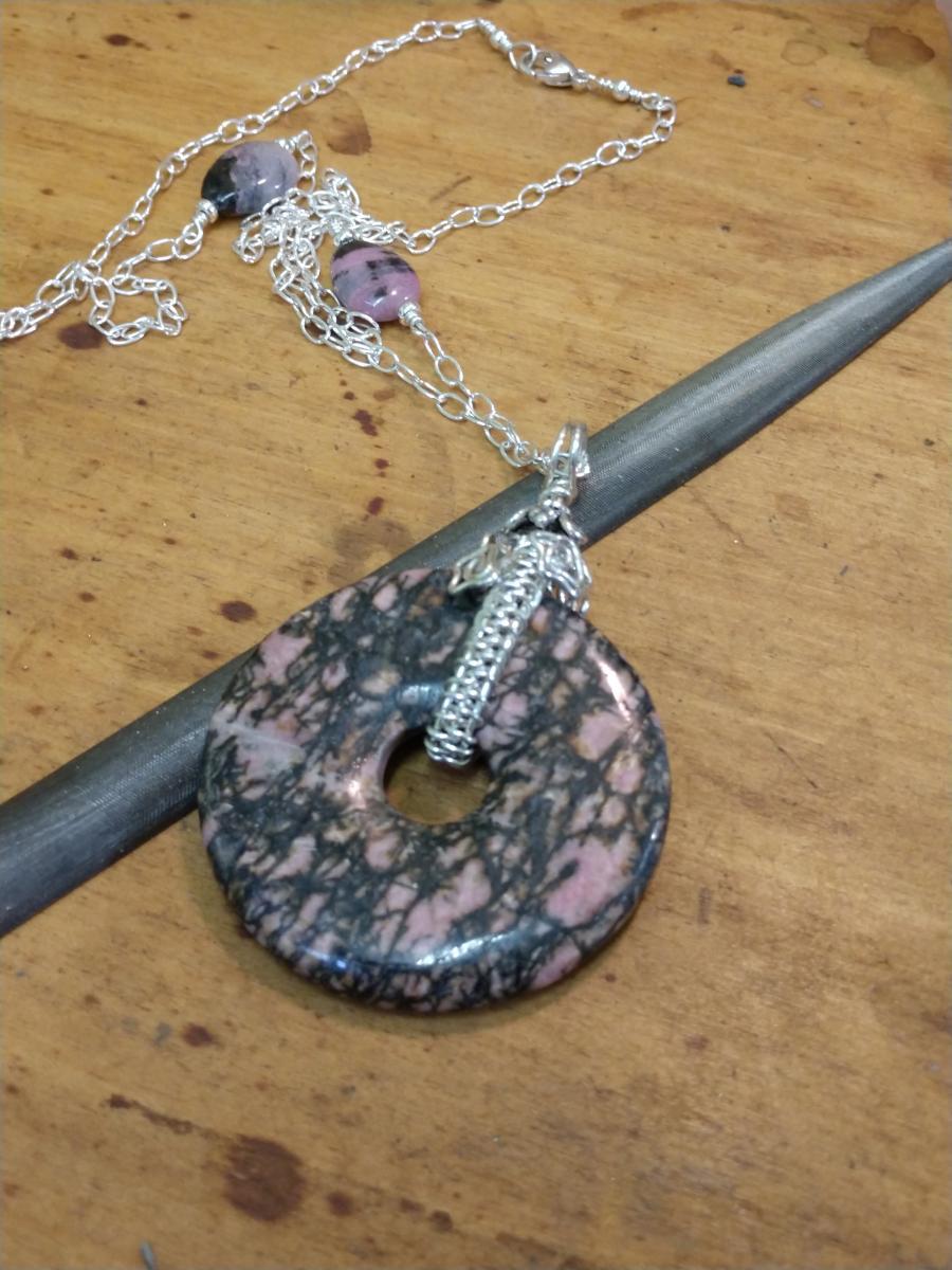 Sterling Silver Wire Wrapped Rhodonite Doughnut Pendant picture