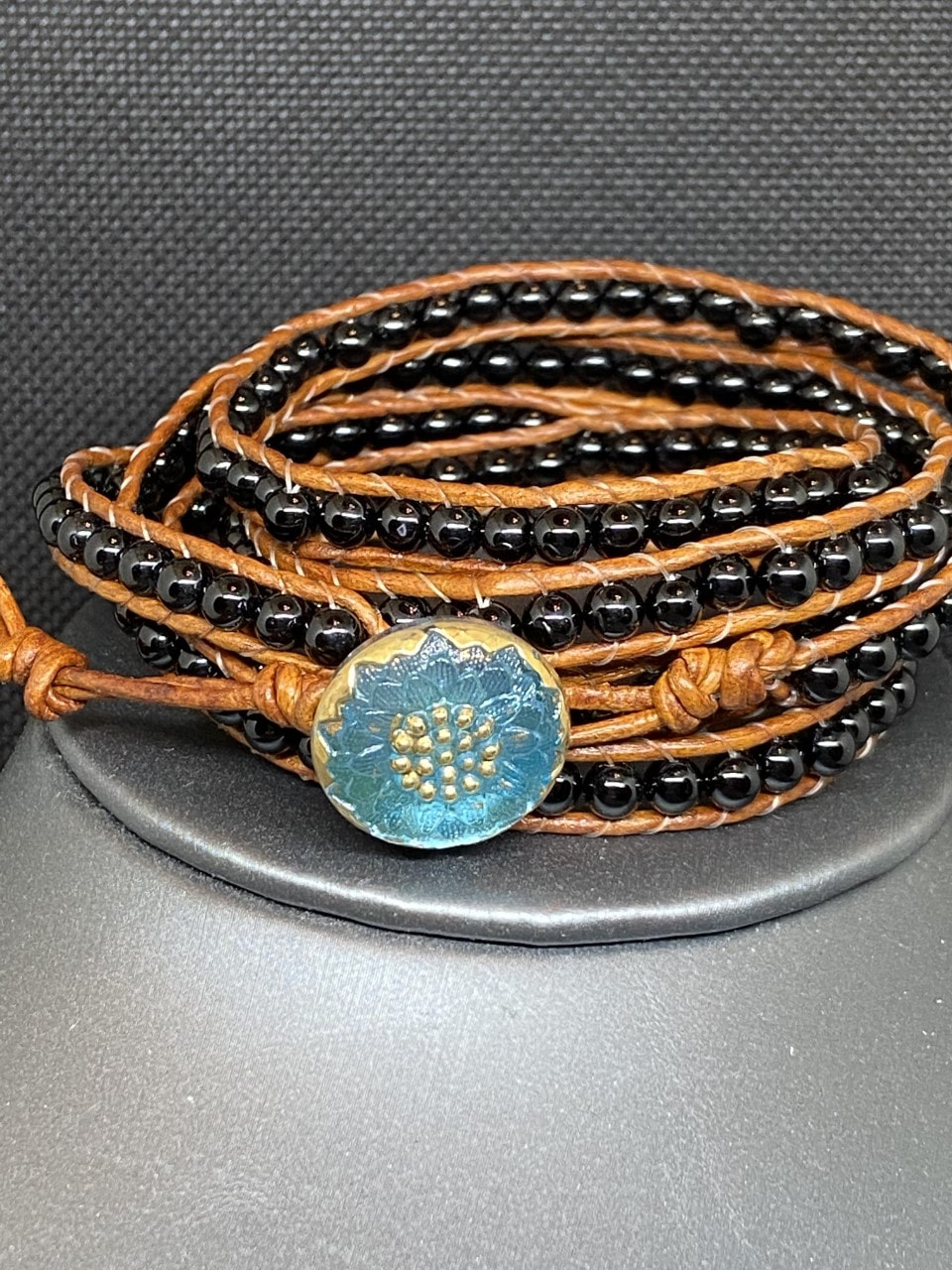 Black Wrap Bracelet on Brown Leather picture