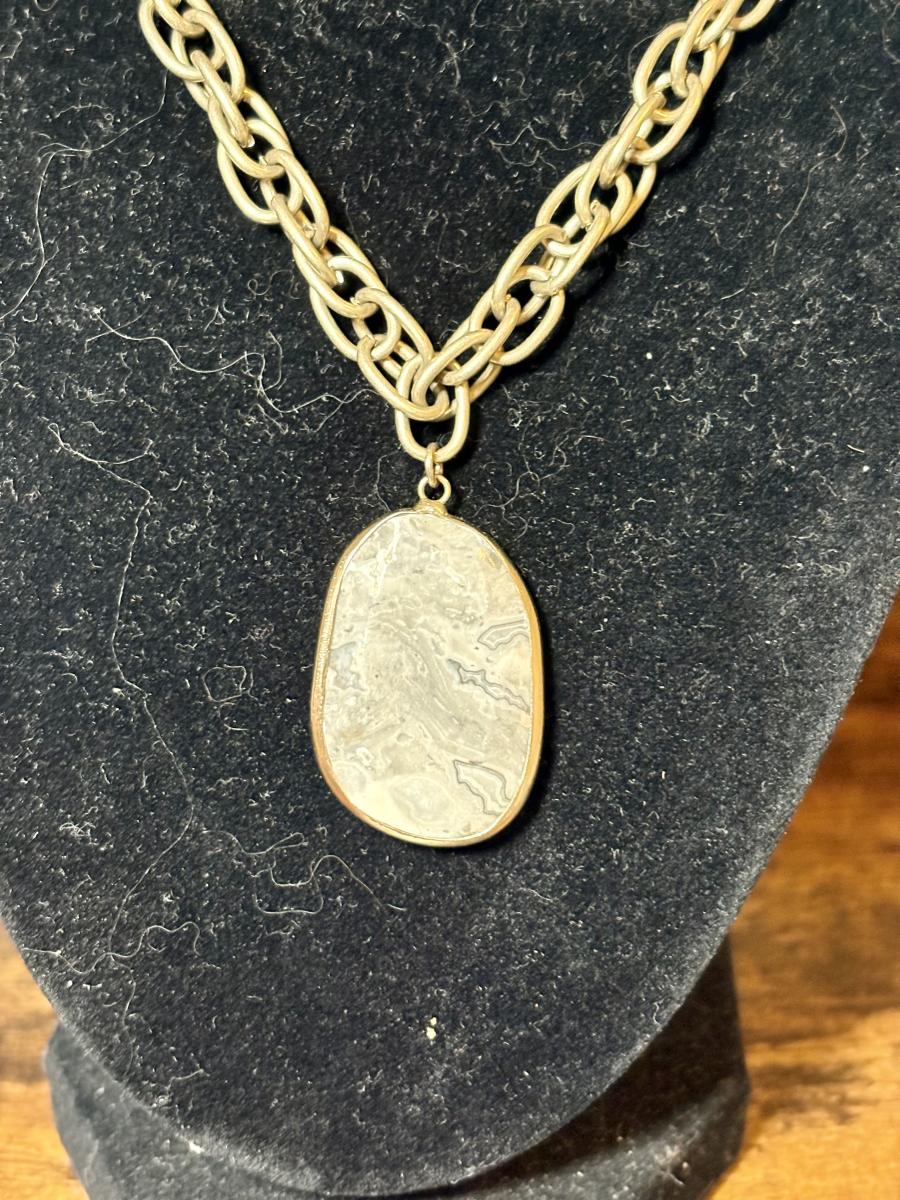 Grey Moss Agate Crystal Pendent on a Gold Tone Chain picture