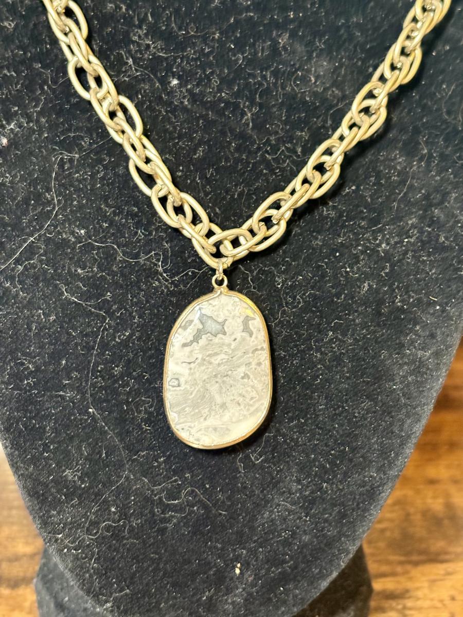 Grey Moss Agate Crystal Pendent on a Gold Tone Chain picture