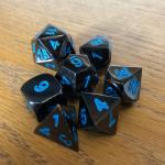 Black with Blue Lettering Metal Dice Set