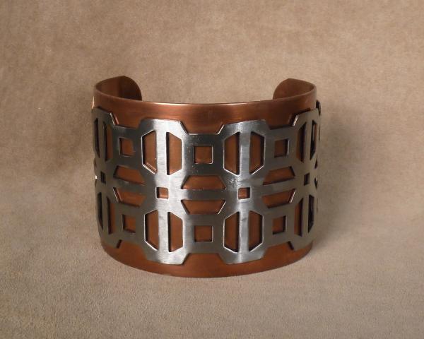 Stanless Cross pattern over brass cuff picture