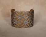 Stanless "X" pattern over brass cuff