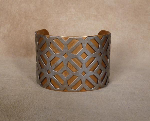 Stanless "X" pattern over brass cuff