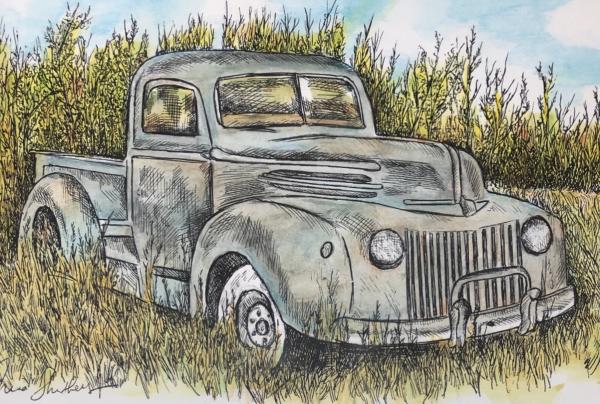 Old truck in field picture