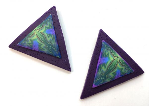"River" earrings, on purple background