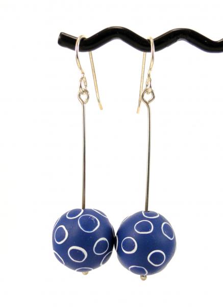 Blue dangly earrings, with white circles