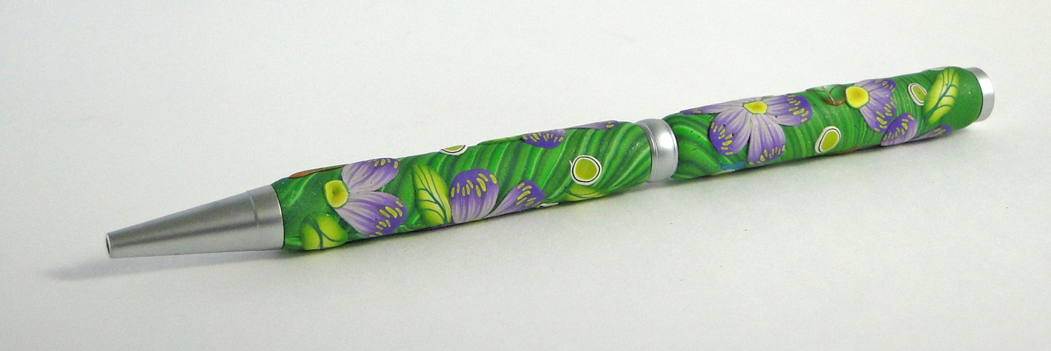 Violet twist pen with swirly leaf design picture