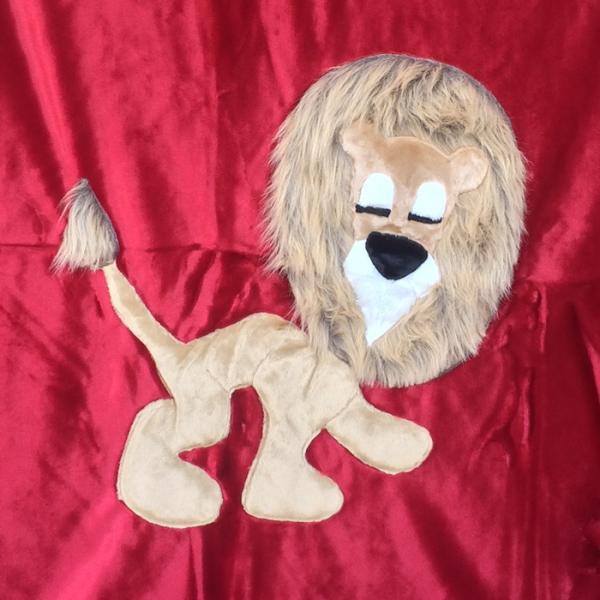 Lion Applique on Red Blanket