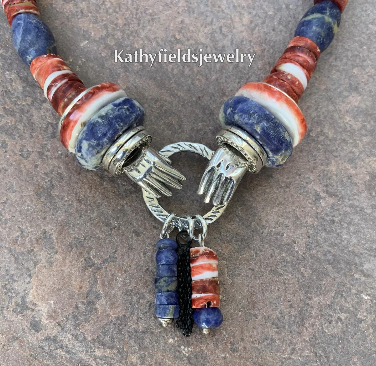 A double silver hand charm necklace picture