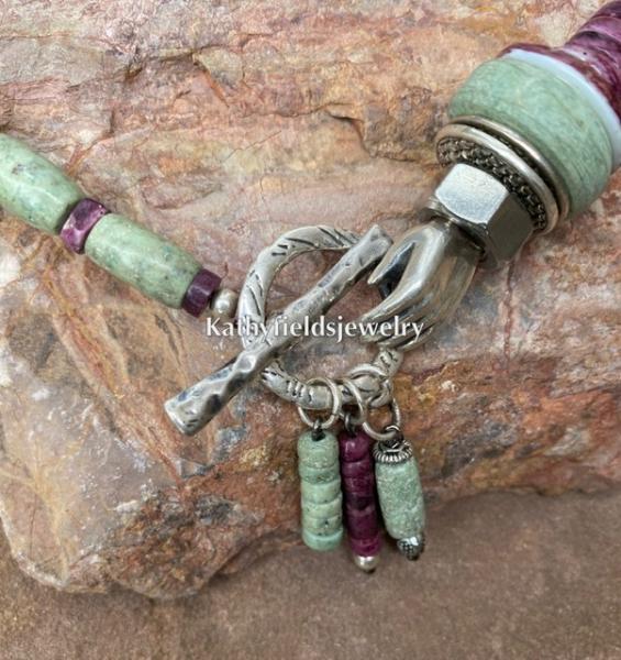 A silver toggle hand charm picture